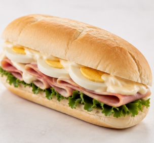 Ham and egg baguette with salad