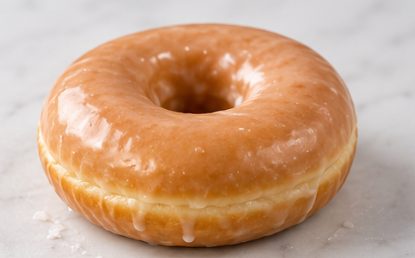 Glazed ring doughnut with sugar glaze