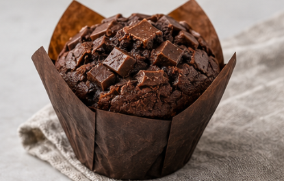 Chocolate muffin topped with chocolate pieces